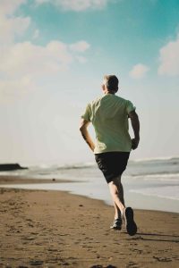 Tunstall | Man running beside the beach-Fun Works